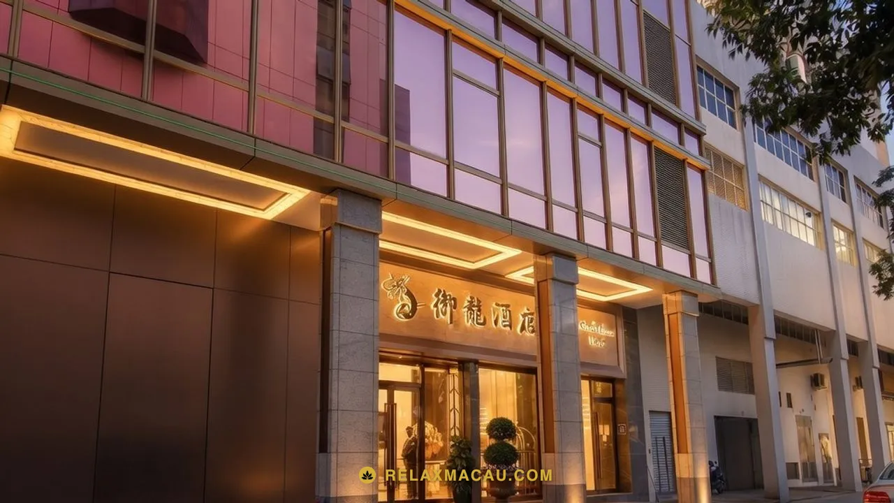 Macau sauna Number Nine Spa's street entrance at the Royal Dragon Hotel at dusk, porch lights on, where the private car stops
